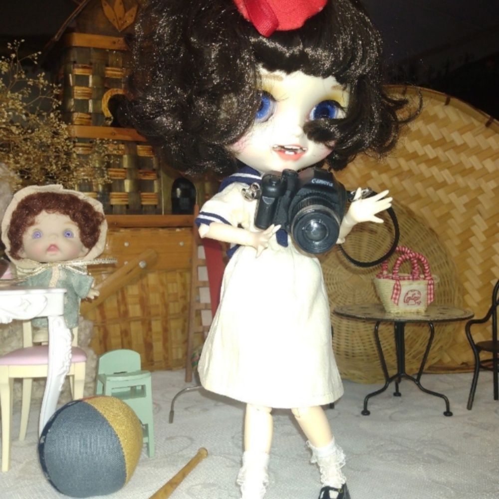 Vintage Doll with Camera and Red Bow